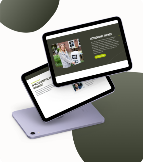 Two tablets displaying a webpage about electric vehicle charging stations on a green and white background.
