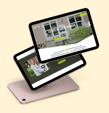 Two overlapping tablets display a website about electric vehicle charging solutions (Opcharge) against a cream background.